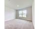 Neutral bedroom showcasing natural light, soft carpet flooring, and a relaxing atmosphere at 16511 66Th E Ln, Parrish, FL 34219