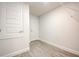 Storage room with tile floors, white walls, and multiple doors, maximizing space and usability at 16511 66Th E Ln, Parrish, FL 34219