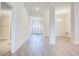 Inviting entryway with tiled floors leads to a dining room and hallway creating an open, airy feel at 16511 66Th E Ln, Parrish, FL 34219