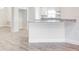 Modern kitchen with granite countertops and a breakfast bar overlooks the dining room and enhances the open layout at 16511 66Th E Ln, Parrish, FL 34219