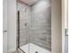 Elegant bathroom shower with gray tile and glass door offers a spa-like experience at 16511 66Th E Ln, Parrish, FL 34219