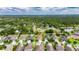 Gorgeous aerial shot showcasing the home's location near green spaces and other residences at 17516 Bright Wheat Dr, Lithia, FL 33547