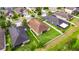 Aerial perspective of the property displaying a lush backyard and neighboring homes at 17516 Bright Wheat Dr, Lithia, FL 33547