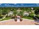 Aerial view of community center surrounded by lush landscaping, palm trees, and accessible parking spaces at 17516 Bright Wheat Dr, Lithia, FL 33547