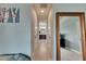Hallway leads to the bathroom with dual sinks and vanity at 17516 Bright Wheat Dr, Lithia, FL 33547