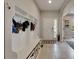 Bright entryway with tile flooring, a storage unit with hooks, and a view into other rooms at 17516 Bright Wheat Dr, Lithia, FL 33547