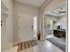 Bright entryway with tile flooring, rug, and a view into the office at 17516 Bright Wheat Dr, Lithia, FL 33547