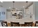Spacious white kitchen with quartz counters, stylish pendants and stainless steel appliances at 17516 Bright Wheat Dr, Lithia, FL 33547