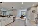 Modern kitchen featuring a central island, sleek countertops, and open layout to dining and living areas at 17516 Bright Wheat Dr, Lithia, FL 33547
