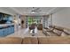 Bright living room features a ceiling fan, recessed lighting, and a screened lanai at 17516 Bright Wheat Dr, Lithia, FL 33547