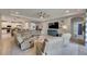 Open-concept living room features comfortable seating and modern decor at 17516 Bright Wheat Dr, Lithia, FL 33547