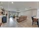 Open-concept living room with neutral-toned furniture, ceiling fan, and recessed lighting at 17516 Bright Wheat Dr, Lithia, FL 33547