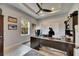 Functional home office with a ceiling fan, natural light, and a large desk at 17516 Bright Wheat Dr, Lithia, FL 33547