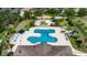 Aerial view of the resort-style community pool and splash pad with plenty of lounge seating at 17516 Bright Wheat Dr, Lithia, FL 33547