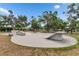 Outdoor skate park with various ramps and obstacles, offering a recreational space for skateboarders at 17516 Bright Wheat Dr, Lithia, FL 33547