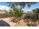 Fenced backyard with brick patio and shady trees at 1801 Mississippi Ne Ave, St Petersburg, FL 33703