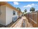 Sideyard of home with brick pathway and shed at 1801 Mississippi Ne Ave, St Petersburg, FL 33703