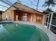 Beautiful backyard pool with the house in the background, perfect for relaxing and enjoying the outdoors at 18104 Sweet Jasmine Dr, Tampa, FL 33647