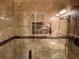 Shower with new tile and mosaic inlay in remodeled bathroom at 18104 Sweet Jasmine Dr, Tampa, FL 33647