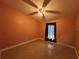 Bright bedroom with tiled flooring, ceiling fan, and a large window at 18104 Sweet Jasmine Dr, Tampa, FL 33647