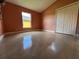 A spacious bedroom with glossy tiled floors and a double-door closet at 18104 Sweet Jasmine Dr, Tampa, FL 33647