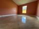 Bright bedroom features high ceilings, tiled floors, and natural light at 18104 Sweet Jasmine Dr, Tampa, FL 33647