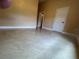 A well-lit bedroom features tiled floors and doorways to other rooms at 18104 Sweet Jasmine Dr, Tampa, FL 33647