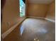 Bright bedroom features neutral walls, a large window, and shiny tile floors at 18104 Sweet Jasmine Dr, Tampa, FL 33647