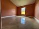 A sunlit bedroom with a vaulted ceiling and shiny tile floors at 18104 Sweet Jasmine Dr, Tampa, FL 33647