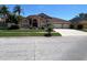 Charming single-story home with a well-manicured lawn and a three-car garage on a sunny day at 18104 Sweet Jasmine Dr, Tampa, FL 33647