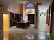 Gourmet kitchen with dark wood cabinets, granite countertops, and an open layout design at 18104 Sweet Jasmine Dr, Tampa, FL 33647