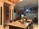 Spacious kitchen featuring a large island with seating and a view into the living area at 18104 Sweet Jasmine Dr, Tampa, FL 33647
