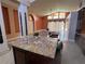 Expansive kitchen island with granite countertop, dual sinks, and ample space for food preparation at 18104 Sweet Jasmine Dr, Tampa, FL 33647