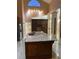 Large kitchen island with a granite countertop and dual sinks, perfect for food preparation at 18104 Sweet Jasmine Dr, Tampa, FL 33647