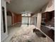 Open kitchen with granite countertops, stainless appliances, and island with sink overlooking the living space at 18104 Sweet Jasmine Dr, Tampa, FL 33647