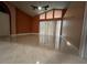 Bright living room featuring vaulted ceilings, fan, large windows and tile flooring at 18104 Sweet Jasmine Dr, Tampa, FL 33647
