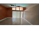 Living room features high ceilings, fan, and large windows providing ample natural light at 18104 Sweet Jasmine Dr, Tampa, FL 33647