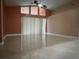 Living room featuring high ceilings, fan, and large windows providing ample natural light at 18104 Sweet Jasmine Dr, Tampa, FL 33647