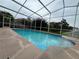 Inviting screened-in pool with refreshing water and ample deck space for lounging and outdoor enjoyment at 18104 Sweet Jasmine Dr, Tampa, FL 33647