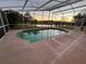 Relaxing screened-in pool area with scenic views and ample space for lounging and enjoying the outdoors at 18104 Sweet Jasmine Dr, Tampa, FL 33647