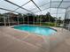 Sparkling screened-in pool offers relaxation, with a patio area perfect for outdoor living and entertaining at 18104 Sweet Jasmine Dr, Tampa, FL 33647