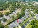 An aerial view showcases a residential area surrounded by lush trees and nearby parking at 19025 Callaway Ct, Tampa, FL 33647