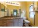 Bathroom with vanity, granite countertop, and neutral color walls at 19025 Callaway Ct, Tampa, FL 33647