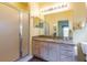 Bathroom features shower stall, granite counters, and bright lighting at 19025 Callaway Ct, Tampa, FL 33647