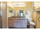 Bathroom features shower stall, granite counters, and bright lighting at 19025 Callaway Ct, Tampa, FL 33647
