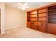 Bedroom showcases custom built-in shelving and a ceiling fan at 19025 Callaway Ct, Tampa, FL 33647