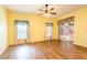 Spacious bedroom with wood floors, large windows, and sliding door access to the lanai at 19025 Callaway Ct, Tampa, FL 33647
