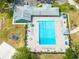 Aerial view of the community pool with clear blue water and plenty of lounge chairs at 19025 Callaway Ct, Tampa, FL 33647