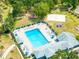 Overhead view of the community pool and lounge area, set amongst lush landscaping and recreational spaces at 19025 Callaway Ct, Tampa, FL 33647