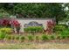 Professionally landscaped community sign 'Club View' with vibrant plants, providing a welcoming entrance at 19025 Callaway Ct, Tampa, FL 33647